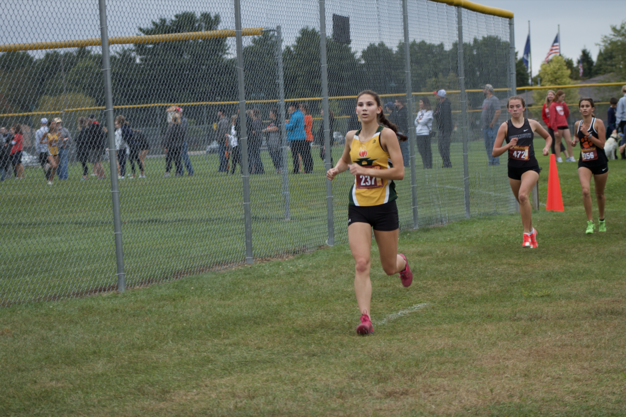 In the middle of her run, senior Lucinda Paliani focuses in for the last half of her run. (Photo by Kaliyah Glenn) 